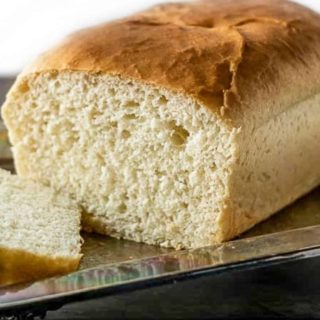 a loaf of White Bread on a tray.