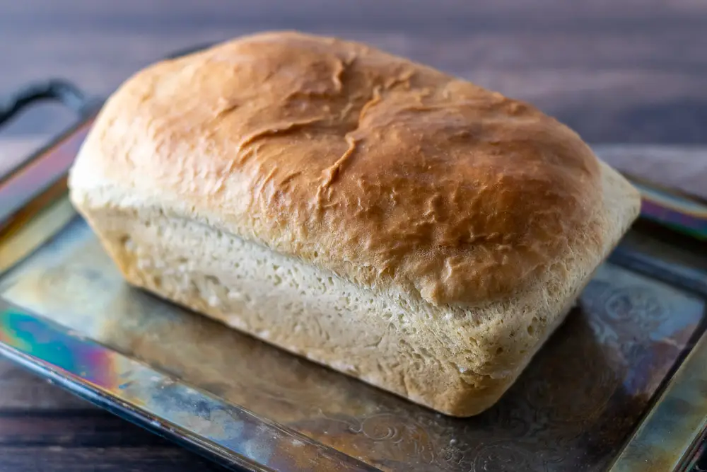 a single Farmhouse Loaf of easy soft white bread on a tray.