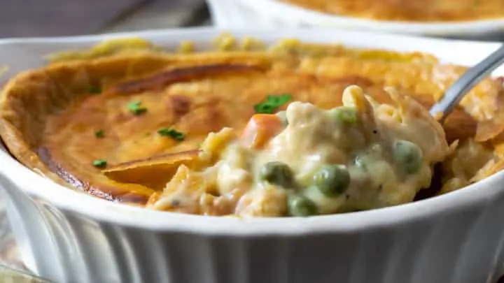chicken pot pie with spoon lifting some out.