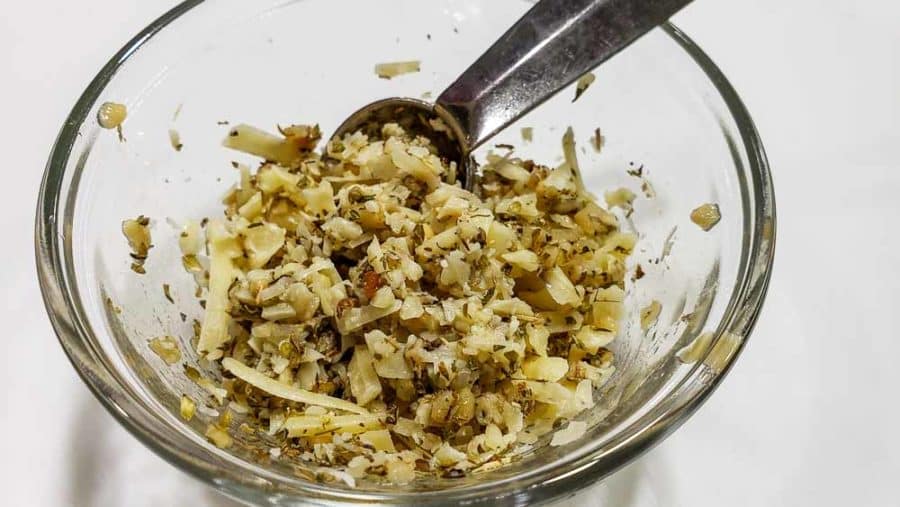 parmesan cheese, garlic, and oregano mixed in a bowl