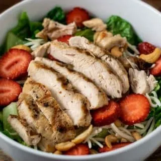 Chicken Strawberry Salad and Poppy Seed Dressing in a bowl