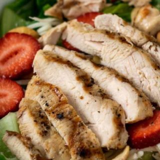 Chicken Strawberry Salad and Poppy Seed Dressing in a bowl.