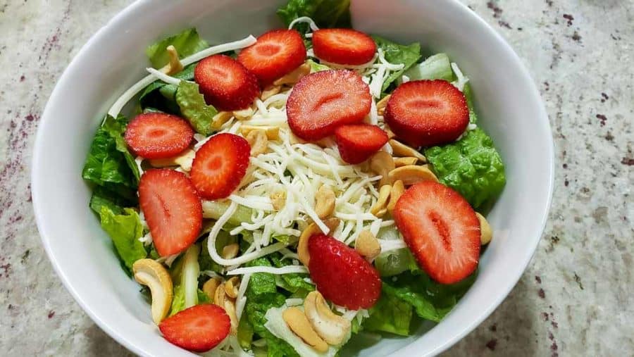 strawberry slices sprinkled over cashews
