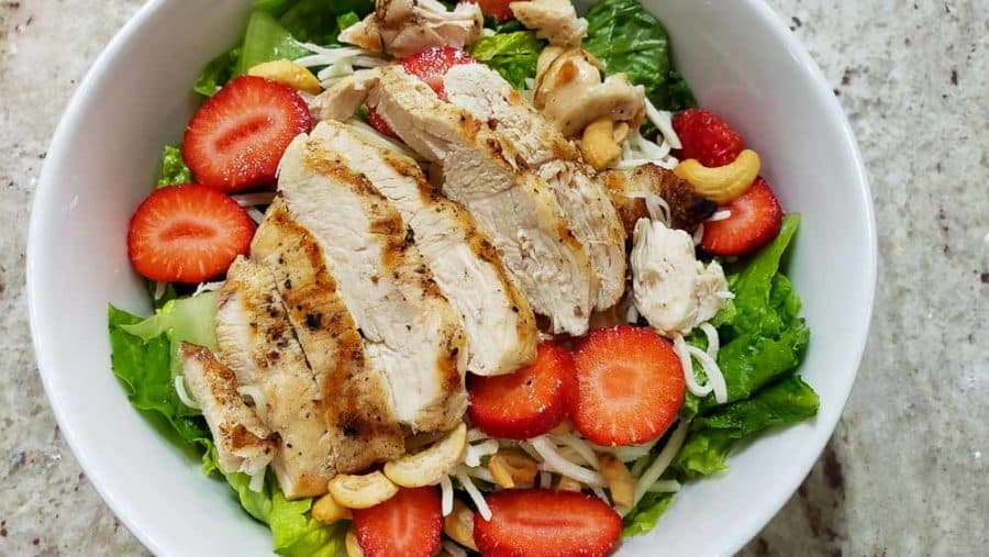 grilled chicken layered on top of strawberries
