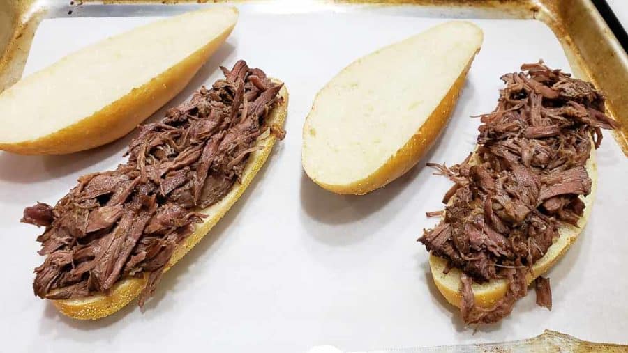shredded roast beef added to hoagie rolls