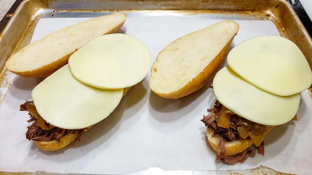 provolone cheese added on top of French Dip Sandwiches.