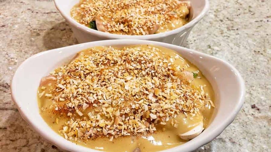 dried onion flakes sprinkled over soup in two dishes