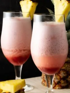 two Hawaiian Lava Flow Tropical Drinks in tall glasses.