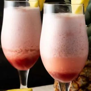 two Hawaiian Lava Flow Tropical Drinks in tall glasses.