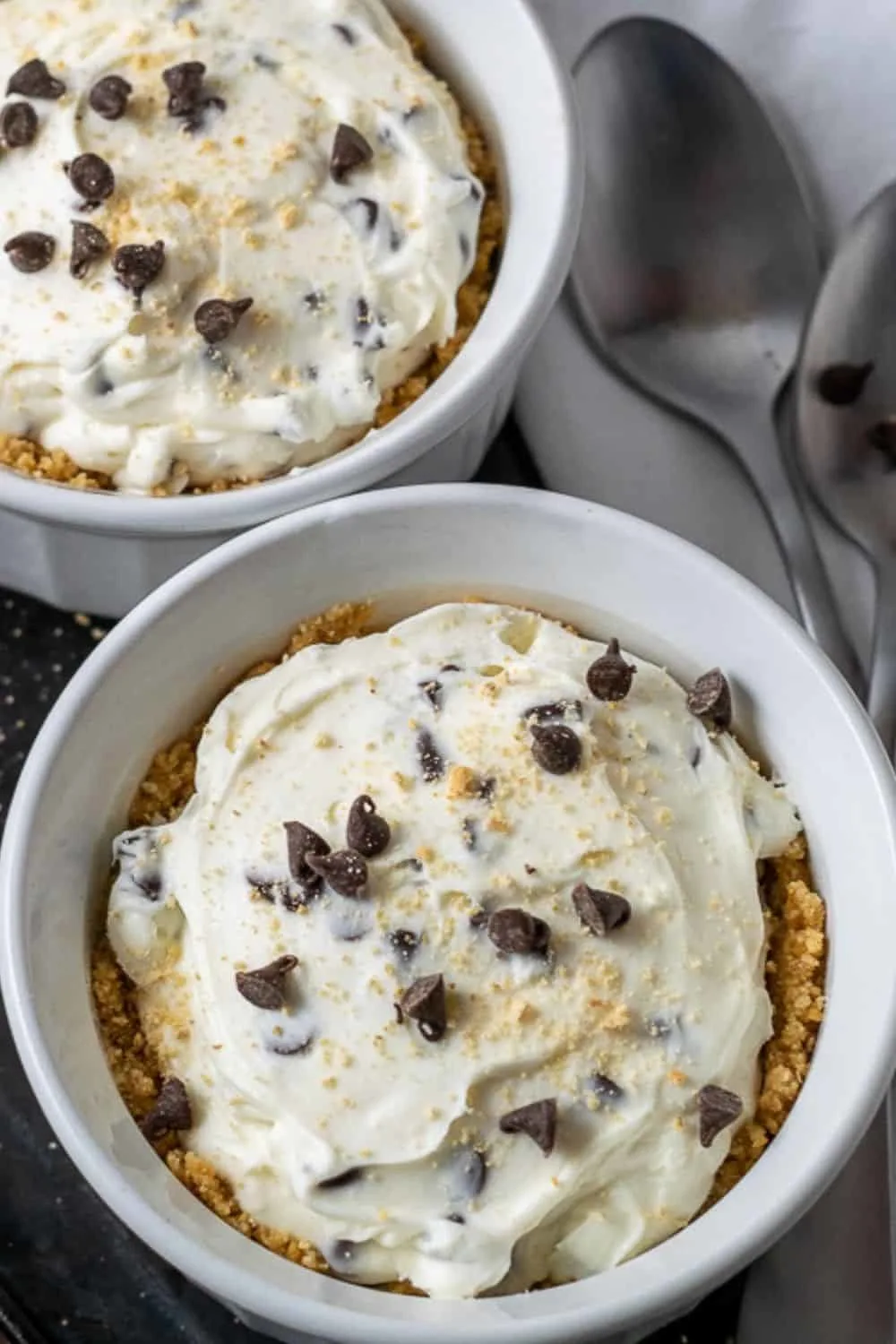 No Bake Chocolate Chip Cheesecakes in ramekin dishes.