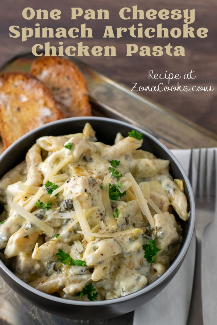 One Pan Cheesy Spinach Artichoke Chicken Pasta in a bowl.