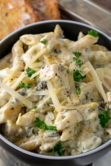Spinach Artichoke Chicken Pasta in a bowl.