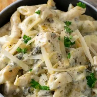 Spinach Artichoke Chicken Pasta in a bowl.