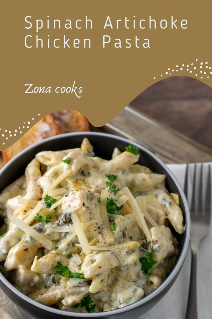 One Pan Cheesy Spinach Artichoke Chicken Pasta in a bowl.