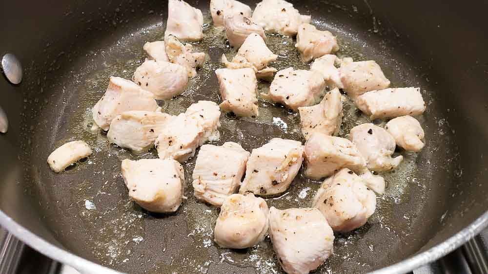diced chicken cooking in a pan