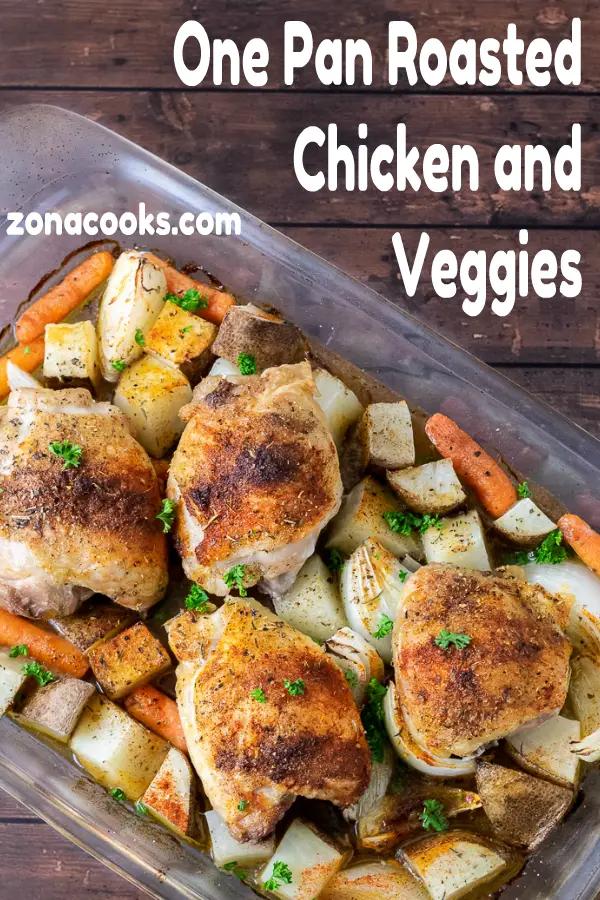 Baked Chicken Thighs with Potatoes and Carrots in a baking dish.