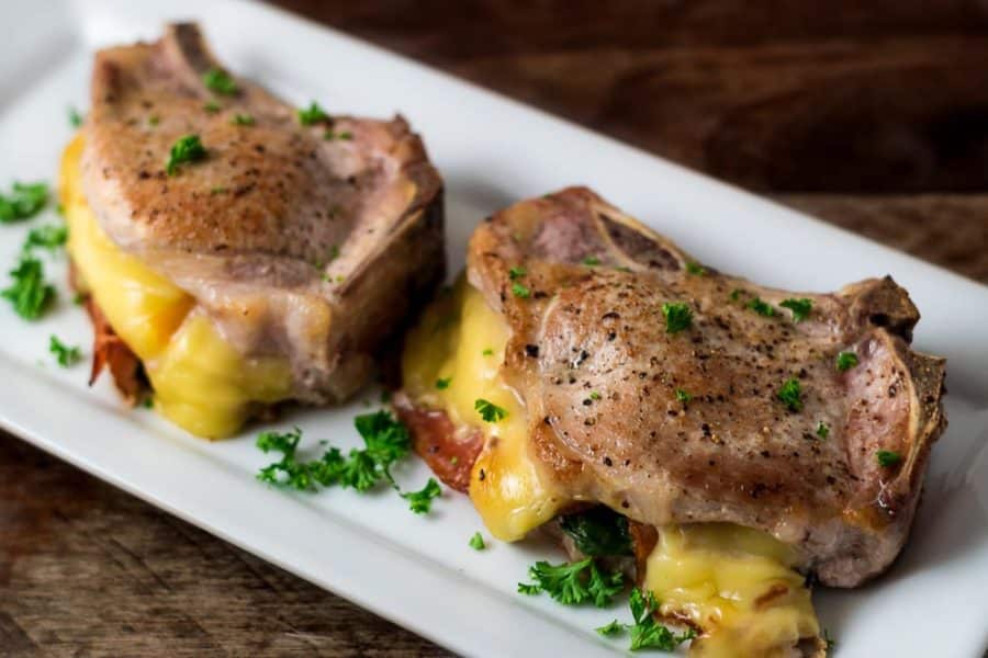 Smoked Gouda and Bacon Stuffed Pork Chops on a platter