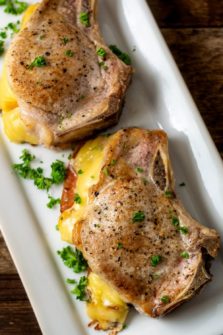 Smoked Gouda and Bacon Stuffed Pork Chops on a platter.