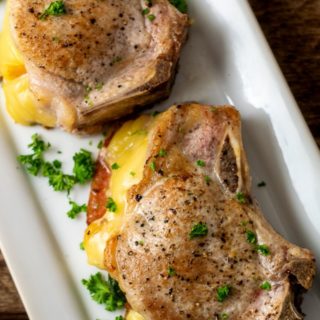 Smoked Gouda and Bacon Stuffed Pork Chops on a platter.