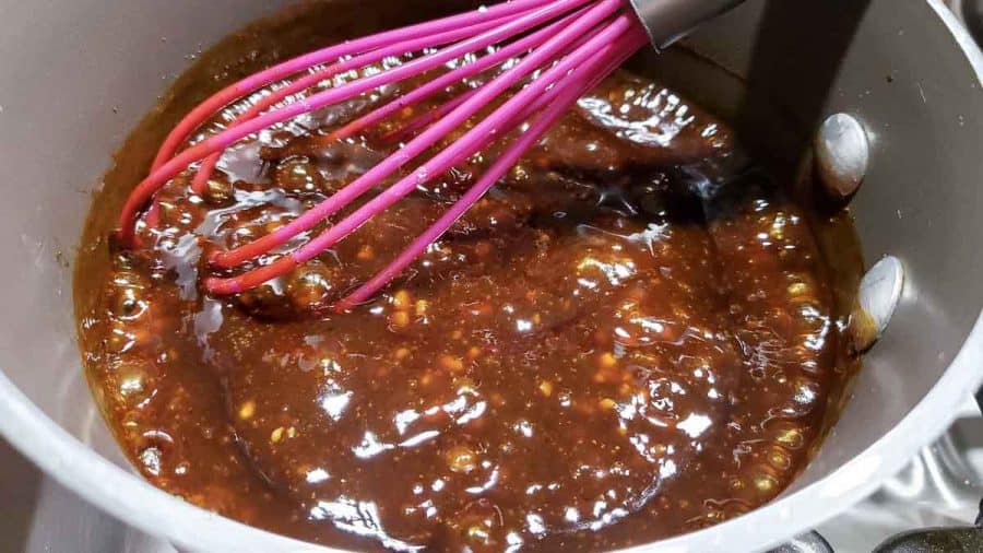 soy sauce mixture thickened with cornstarch in a sauce pan with a wisk