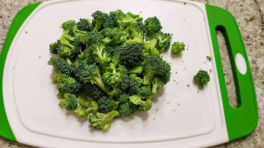 chopped broccoli on a cutting board