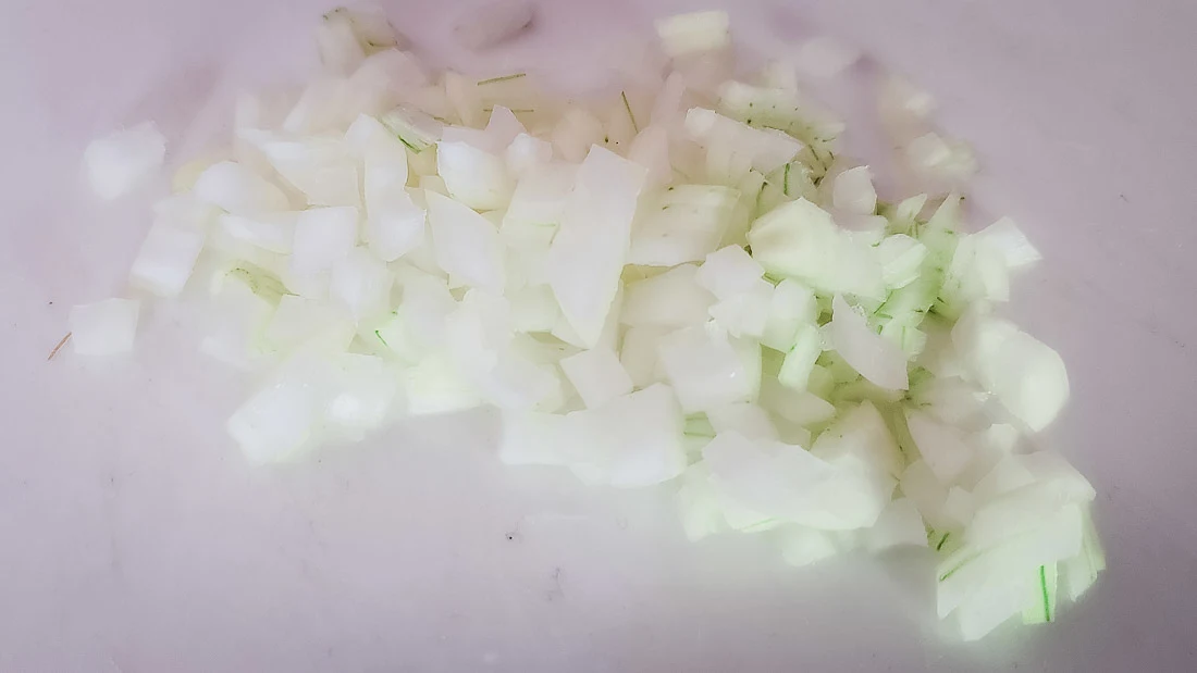 onions diced fine on a cutting board.