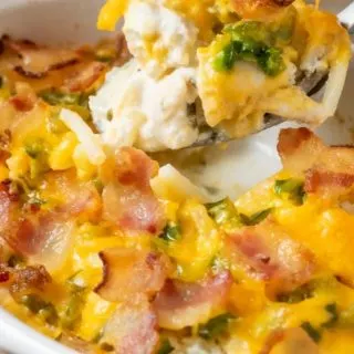 Jalapeño Popper Chicken Casserole with a spoon lifting up some of the casserole out of the dish.