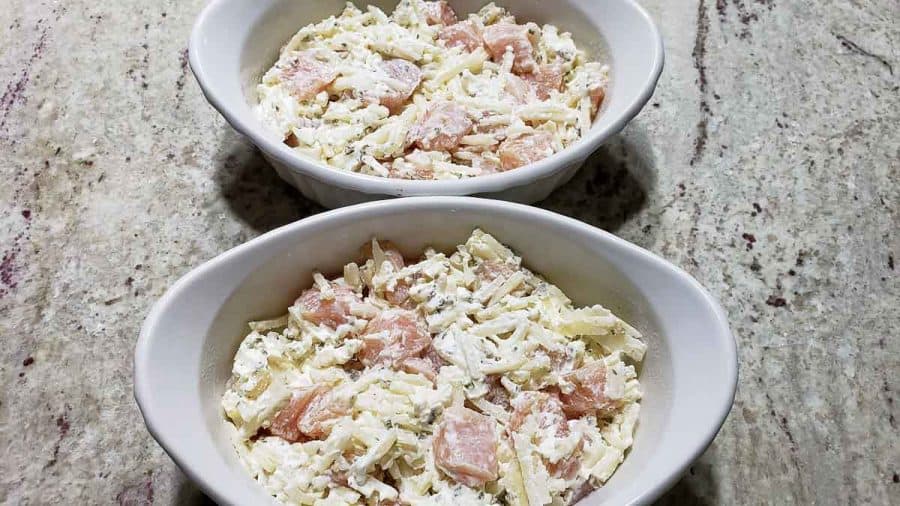 chicken hashbrown mixture divided into two baking dishes