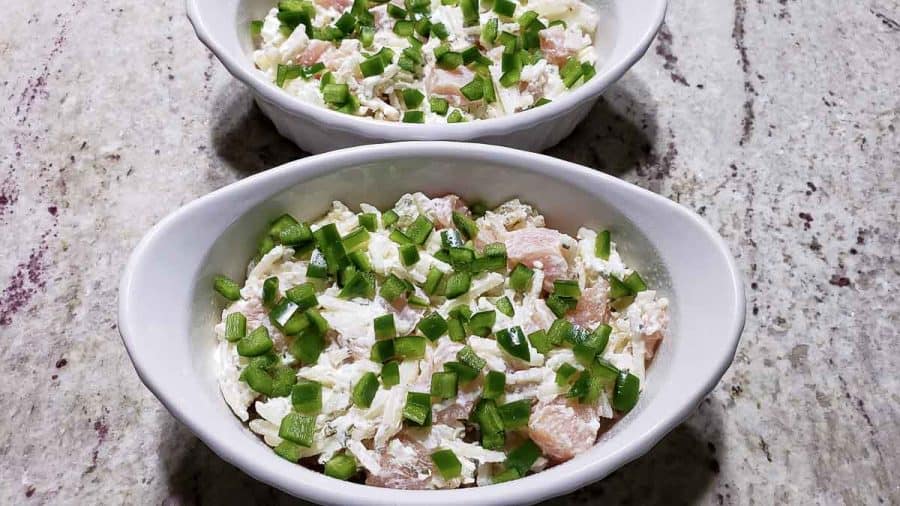diced jalapeno peppers sprinkled into the two baking dishes