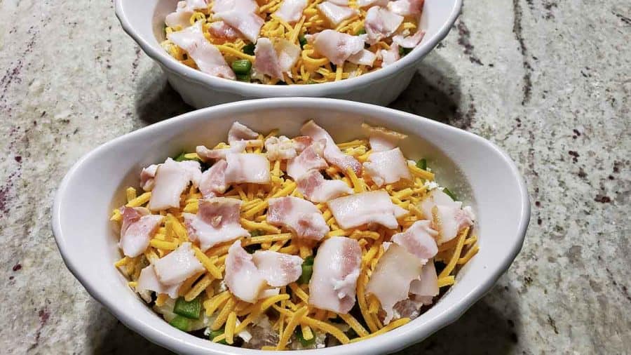 1/2 inch pieces of bacon layered over the cheese in the two baking dishes