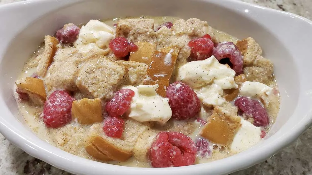 raspberry French toast mixture poured into a casserole dish