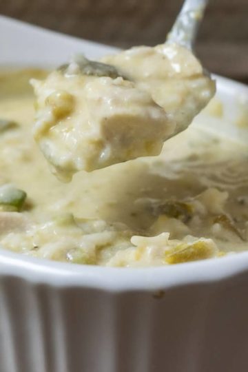 Green Chile Chicken and Rice Casserole in a dish with a spoon lifting some out