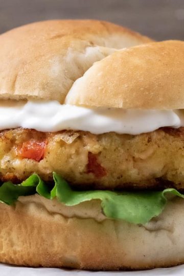a close up front view of a salmon burger