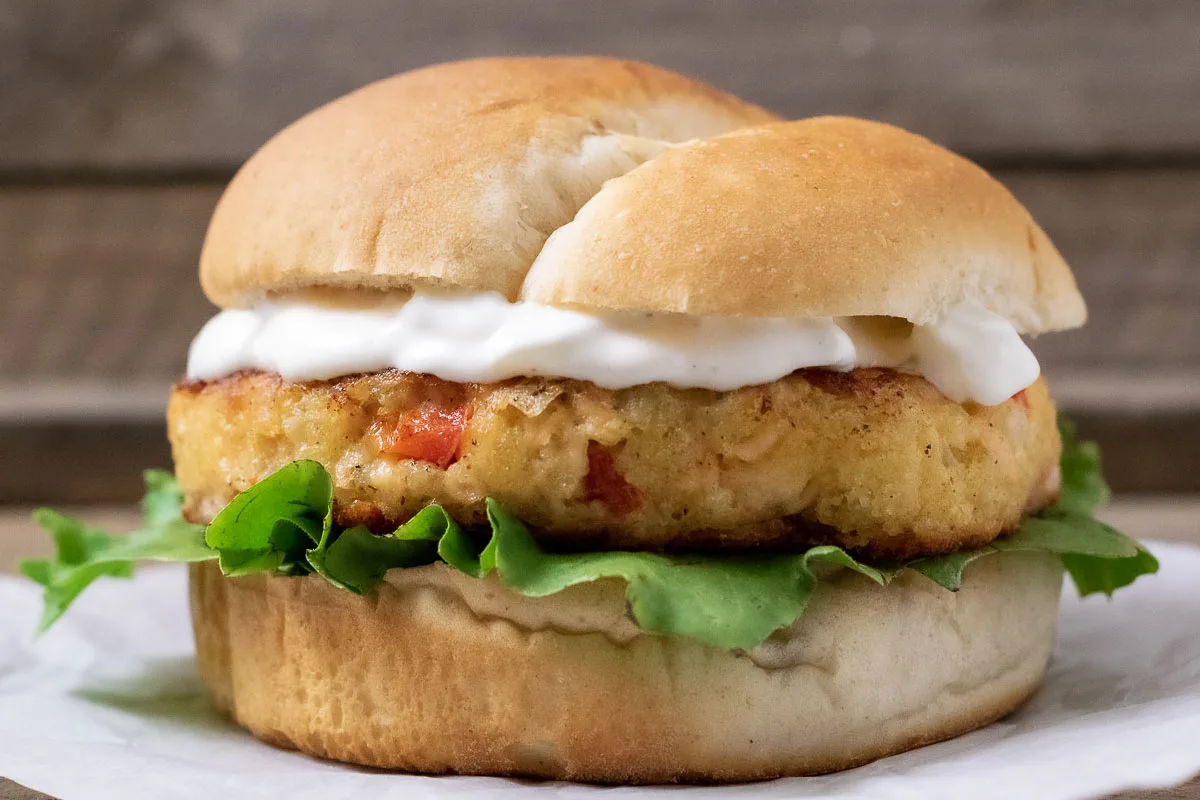a close up front view of an easy salmon burger from scratch.