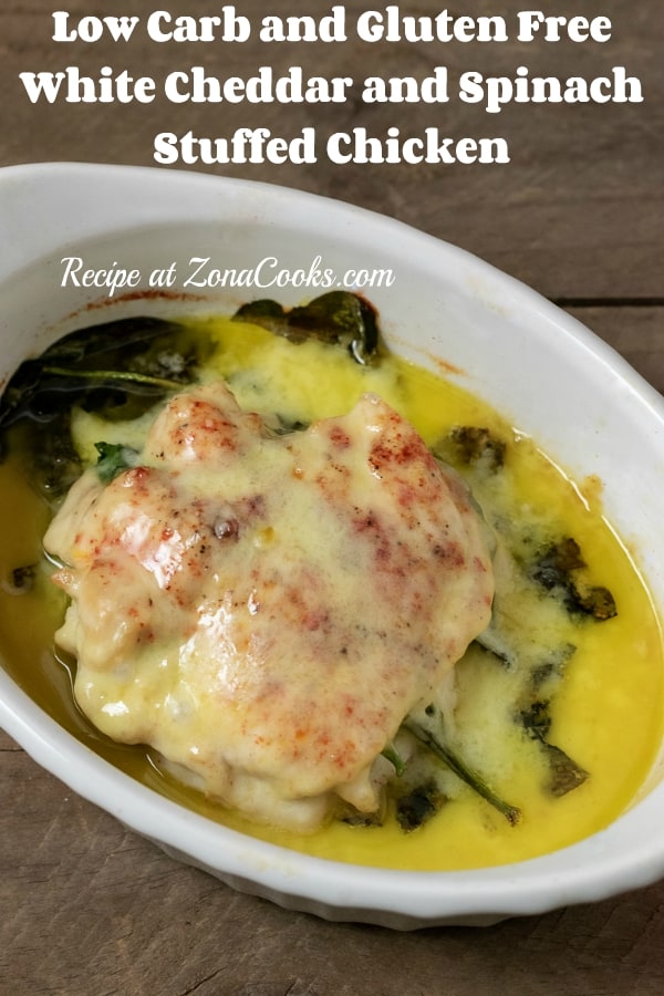 a graphic of Cheesy Spinach Stuffed Chicken with melted white cheddar in a baking dish.