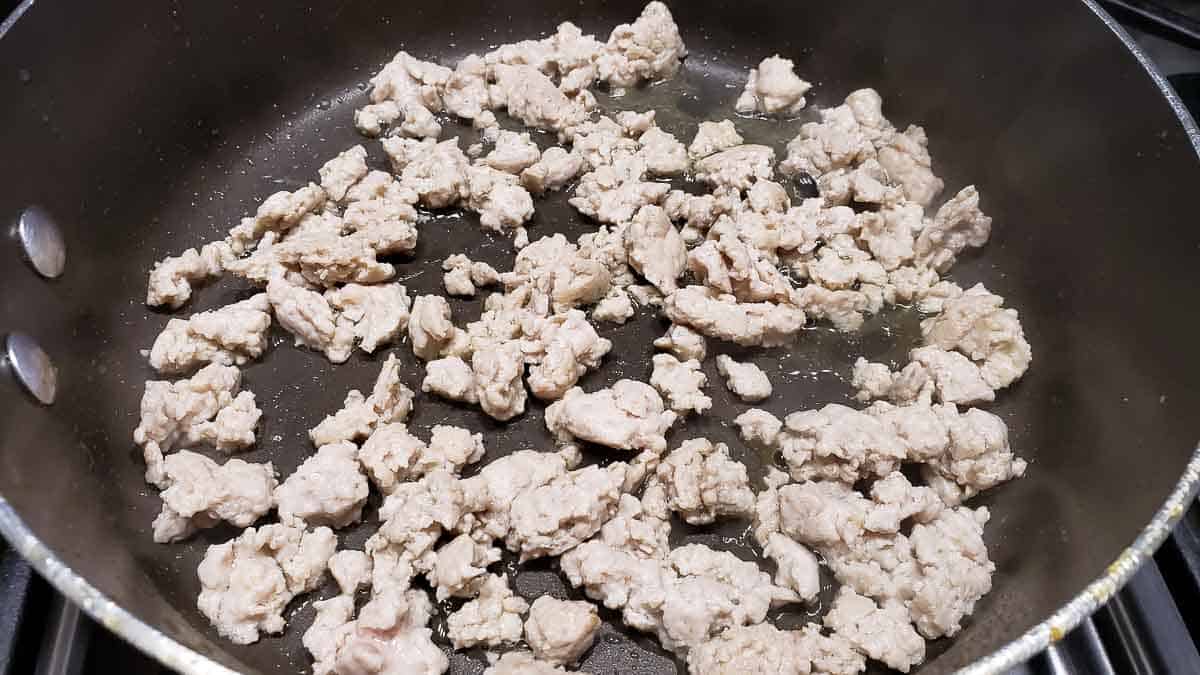 ground chicken cooking in a pan.