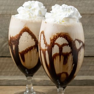 two Banana Mocha Frappe drinks topped with whipped cream