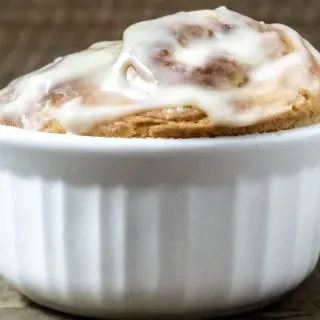 front close up view of jumbo cinnamon roll in a ramekin