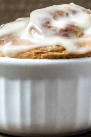 front close up view of jumbo cinnamon roll in a ramekin