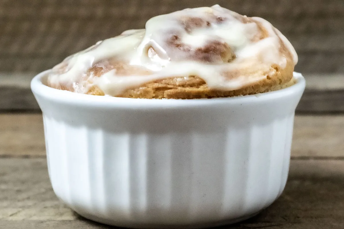 front close up view of jumbo cinnamon roll in a ramekin.