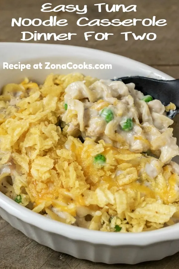 Easy Cheesy Tuna Noodle Casserole with a spoon scooping out some casserole.