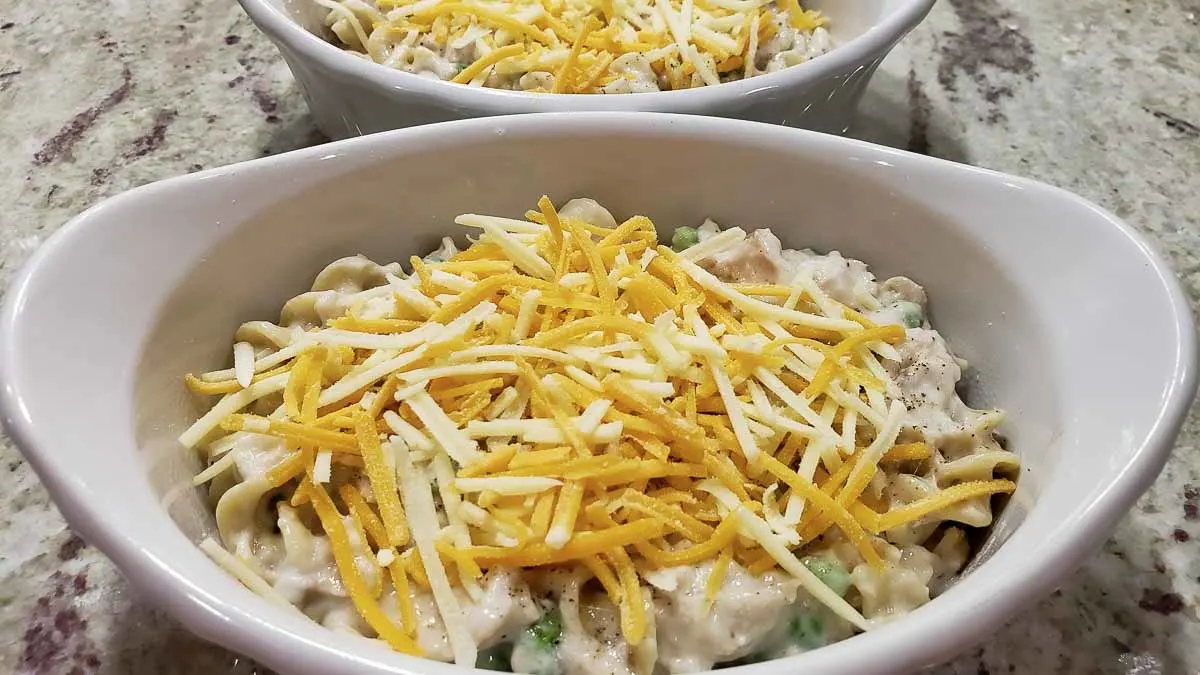 shredded cheese sprinkled on top of the tuna casseroles.
