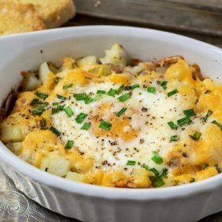 Individual Breakfast Bake casserole on a tray with a side of toast
