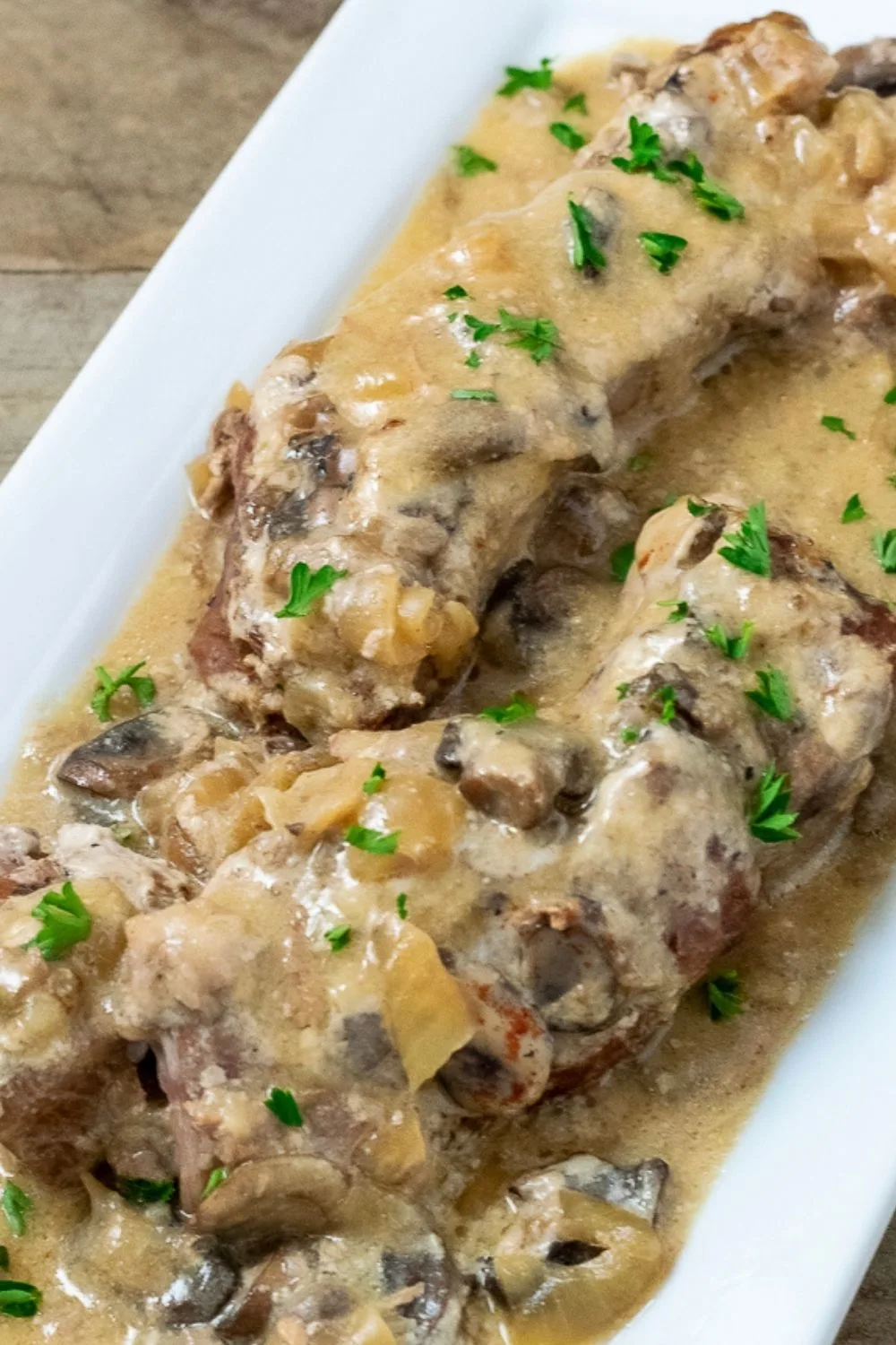 Slow Cooker Country Style Pork Ribs and Mushroom Gravy on a platter.