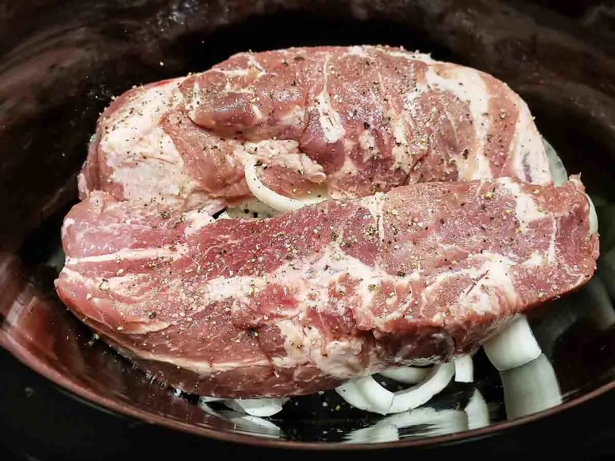 Country Spare Ribs in Crock Pot over onions.