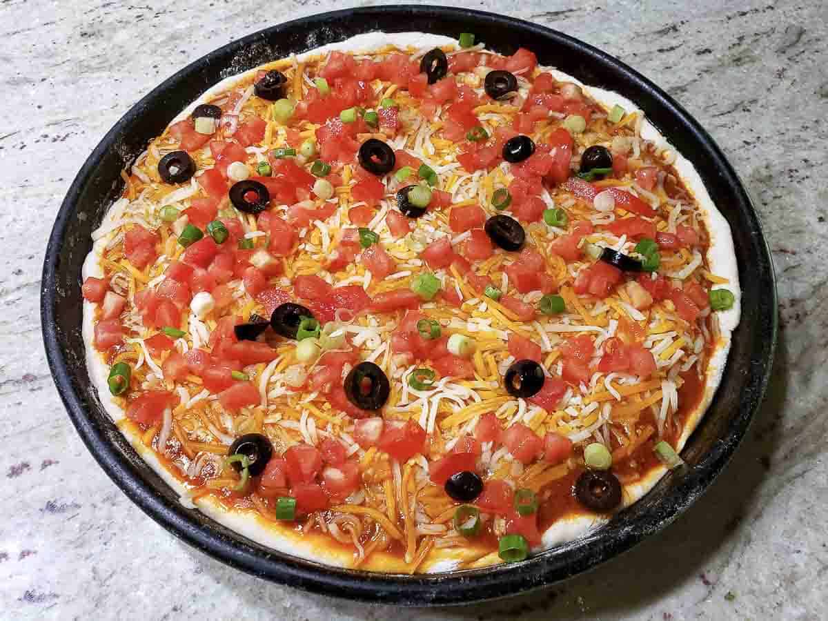 enchiladas toppings added to pizza.