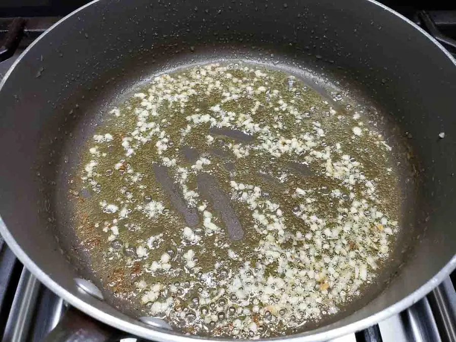 olive oil and garlic cooking in a pan