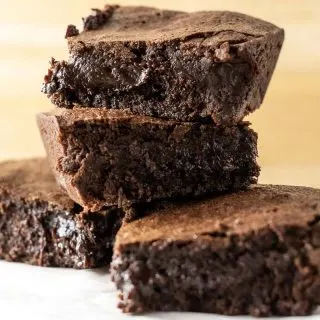4 chewy fudge brownies stacked in a pile