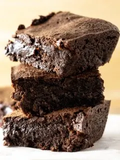 3 fudgy chewy brownies stacked on top of each other
