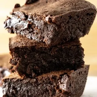 3 fudgy chewy brownies stacked on top of each other